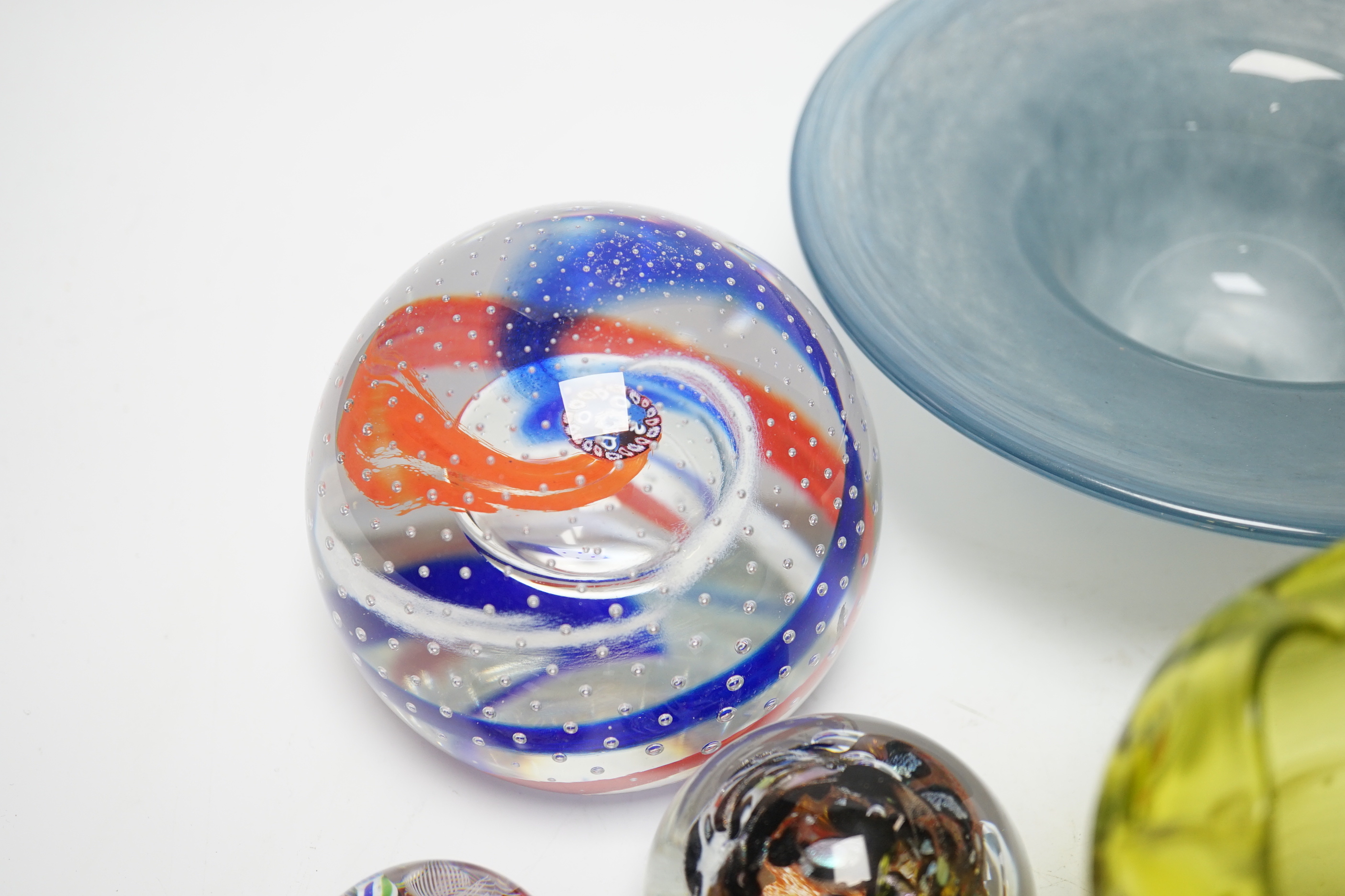 A group of mixed studio glass and a collection of four paperweights including one large Caithness